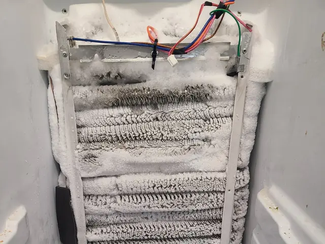Frozen refrigerator evaporator coil defrost service for a Carmel appliance repair customer
