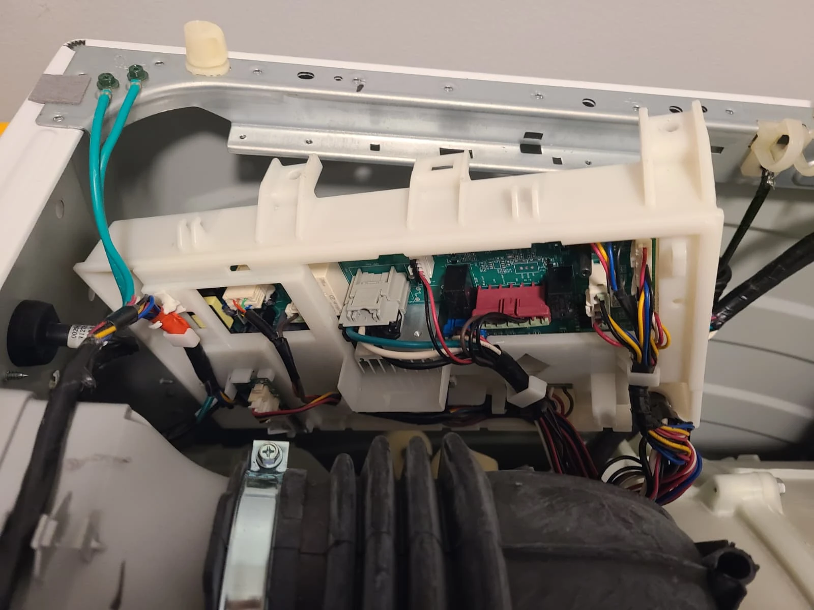 Replacement control board connected in the washer during reassembly