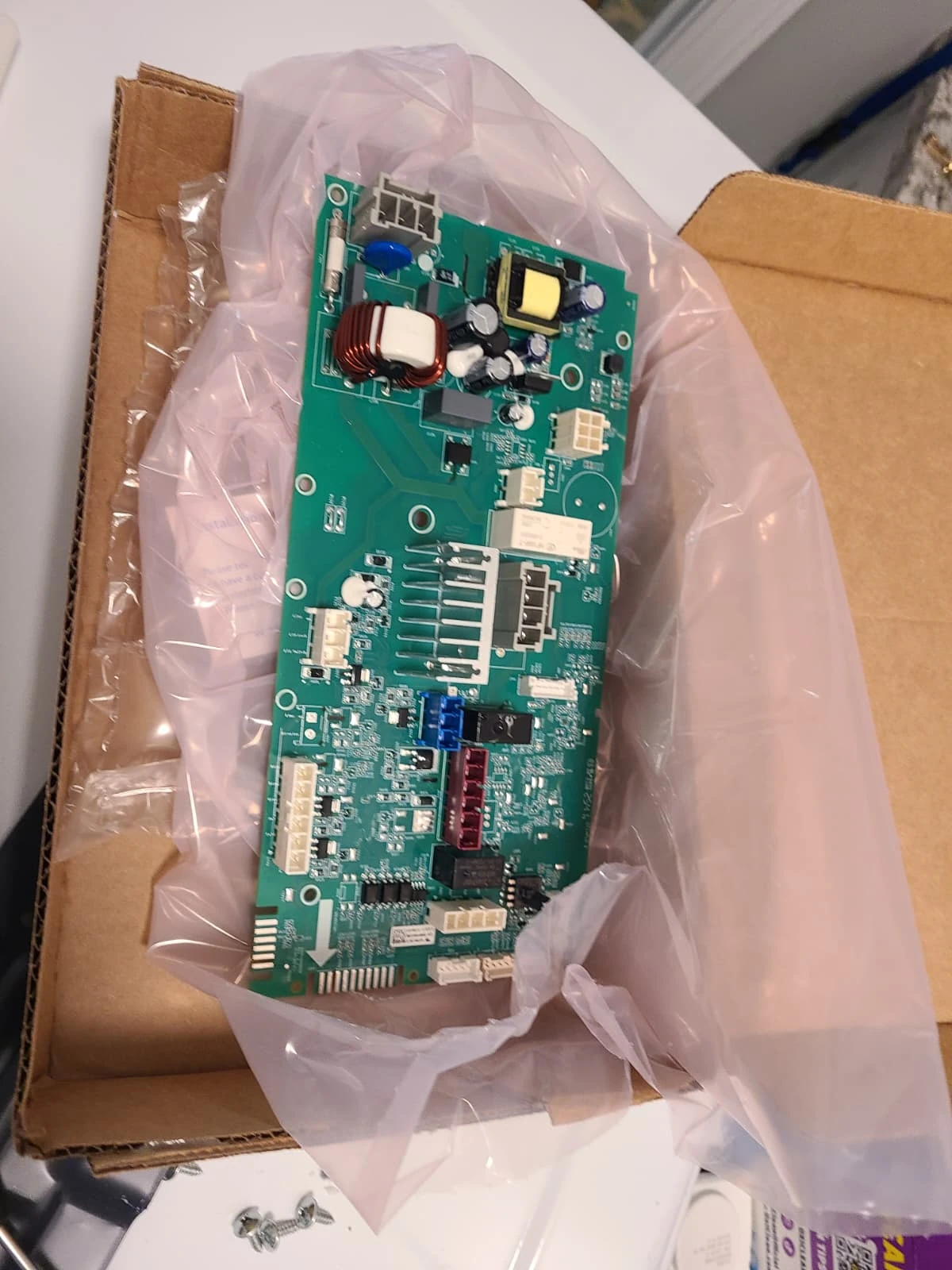 Replacement GE washer control board before installation
