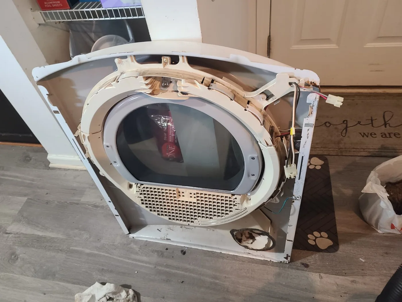 After: front panel with the heavy lint deposits removed; existing surface wear remains visible