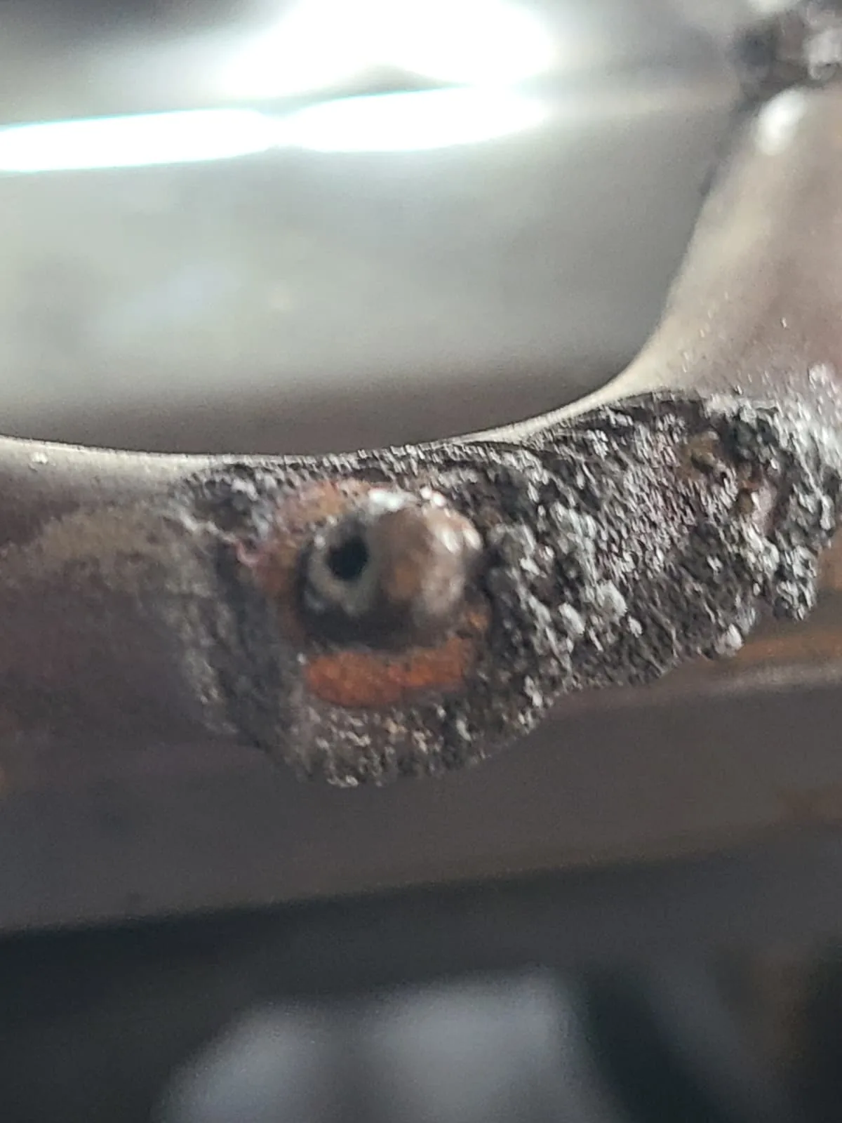 Burned section of the KitchenAid bake heating element before replacement