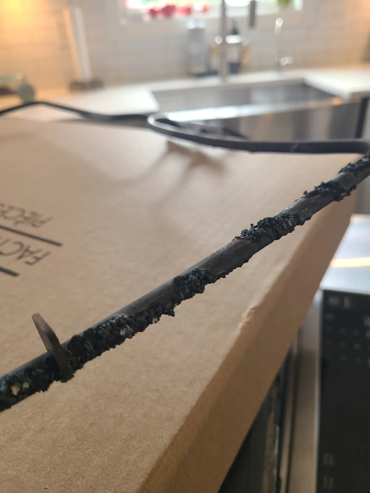 Close view of damage along the old bake heating element
