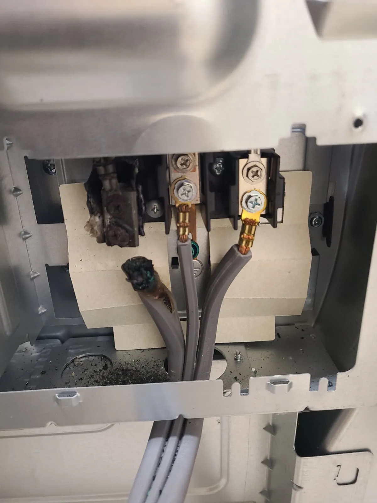 Burned power terminal and damaged power cord on the LG LDE4413ST range before repair