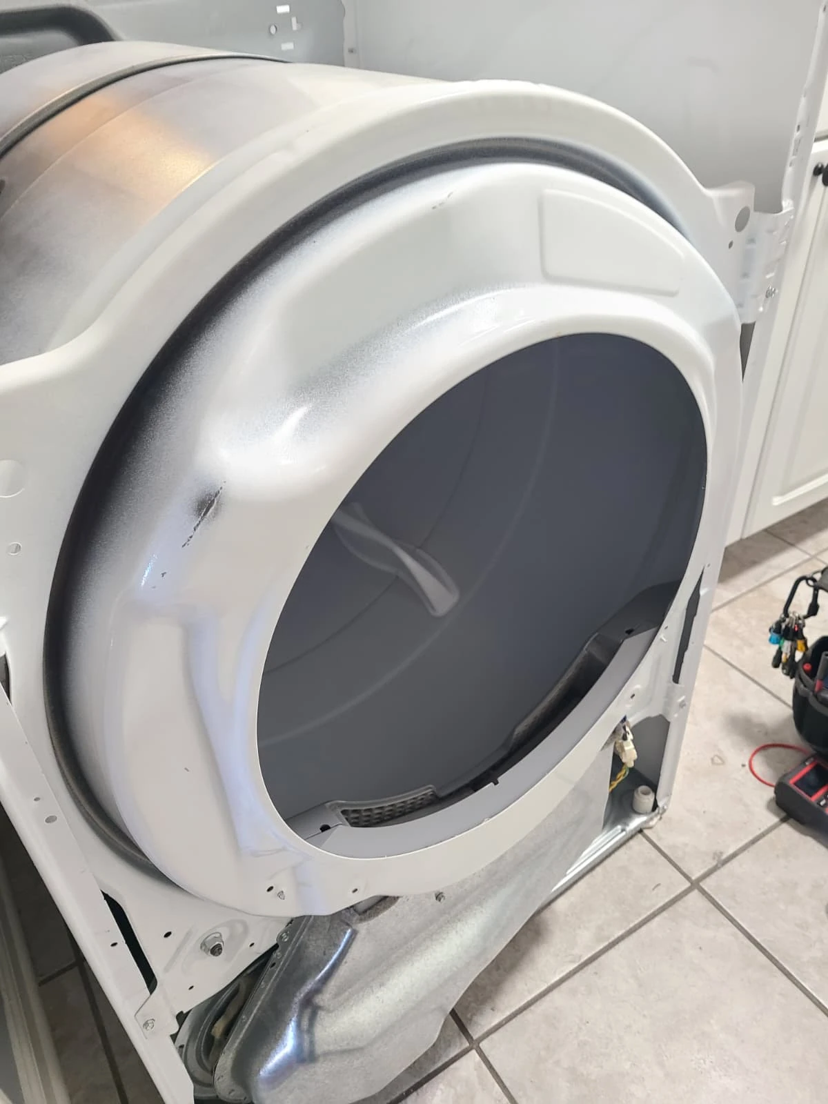 Drum and front support reinstalled during reassembly