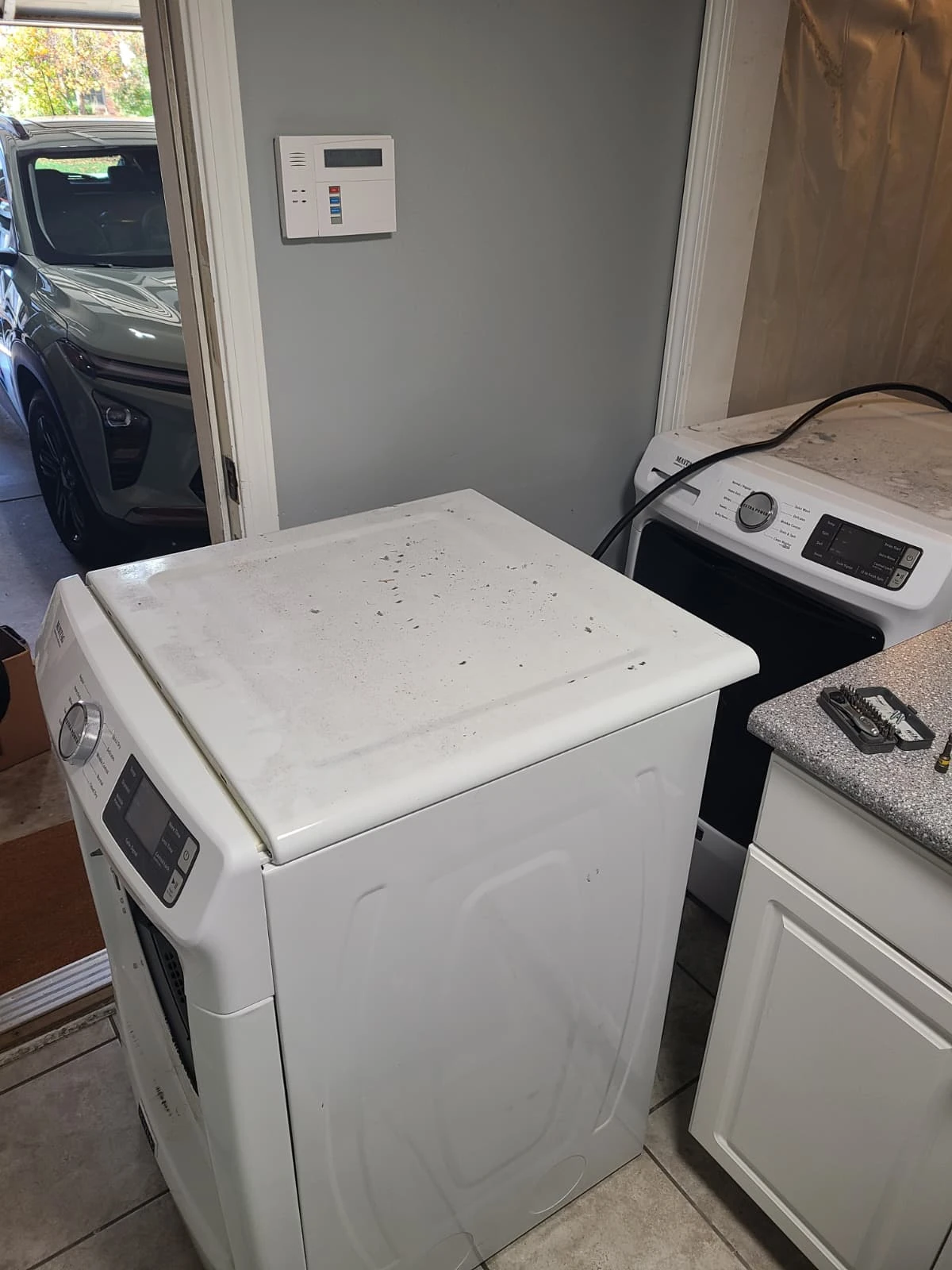 Maytag dryer removed from the stacked installation to provide service access