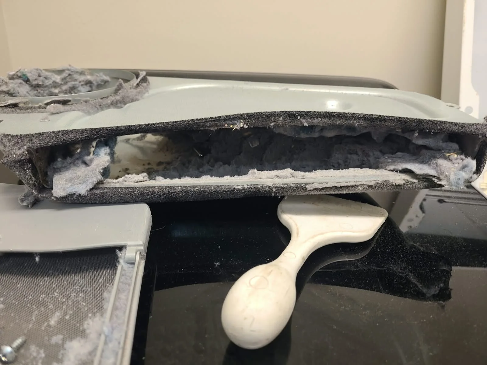 Removed lint duct with accumulated lint inside before cleaning